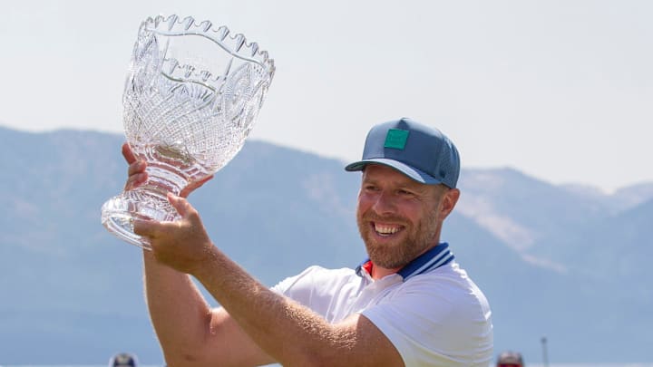 Joe Pavelski holds the championship trophy during the final round of the American Century Celebrity Championship golf tournament at Edgewood Tahoe Golf Course in Stateline, Nev., Sunday, July 13, 2025.