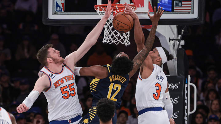 Apr 9, 2023; New York, New York, USA; New York Knicks guard Josh Hart (3) blocks a shot by Indiana Pacers forward Oshae Brissett (12) as center Isaiah Hartenstein (55) defends during the second half at Madison Square Garden. Mandatory Credit: Vincent Carchietta-USA TODAY Sports