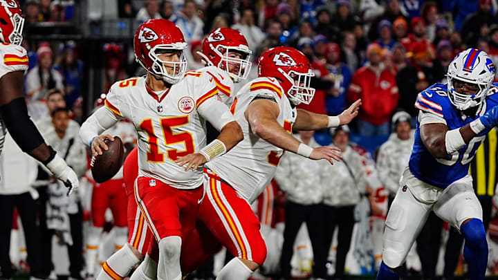 Bills Greg Rousseau follows Kansas City quarterback Patrick Mahomes while the offensive line tries to keep Rousseau away from Mahomes during second half action against the Kansas City Chiefs in Orchard Park, Nov.17, 2024.