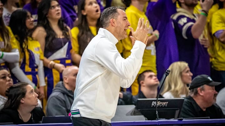 Danny Sprinkle can get excited at times while working the UW sideline. 