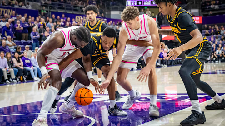 Franck Kepnang and Hannes Steinbach scramble for a loose ball against Iowa. Franck Kepnang and Hannes Steinbach scramble for a loose ball against Iowa.