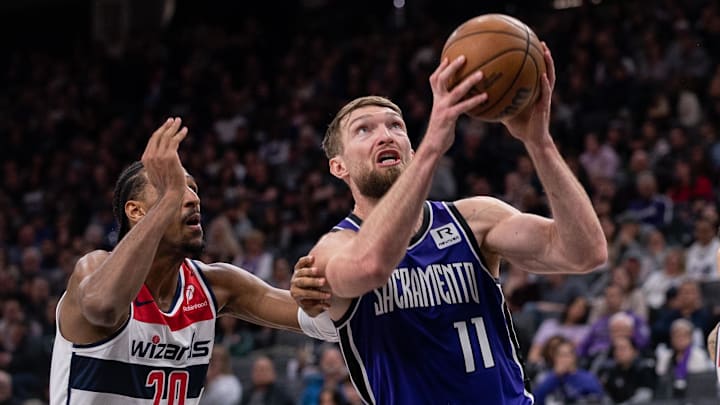 Jan 19, 2025; Sacramento, California, USA; Sacramento Kings forward Domantas Sabonis (11) drives to the basket against Washington Wizards forward Alexandre Sarr (20) during the third quarter at Golden 1 Center. Mandatory Credit: Ed Szczepanski-Imagn Images Jan 19, 2025; Sacramento, California, USA; Sacramento Kings forward Domantas Sabonis (11) drives to the basket against Washington Wizards forward Alexandre Sarr (20) during the third quarter at Golden 1 Center. Mandatory Credit: Ed Szczepanski-Imagn Images