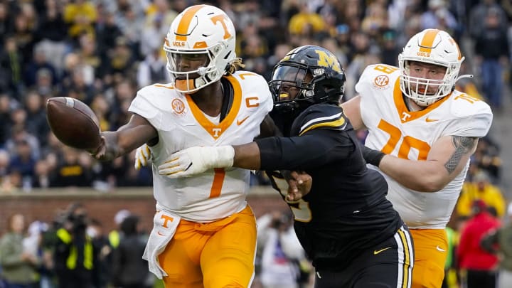Nov 11, 2023; Columbia, Missouri, USA; Tennessee Volunteers quarterback Joe Milton III (7) pitches the ball as he is hit by Missouri Tigers defensive lineman Kristian Williams (5) during the second half at Faurot Field at Memorial Stadium. Mandatory Credit: Jay Biggerstaff-USA TODAY Sports Nov 11, 2023; Columbia, Missouri, USA; Tennessee Volunteers quarterback Joe Milton III (7) pitches the ball as he is hit by Missouri Tigers defensive lineman Kristian Williams (5) during the second half at Faurot Field at Memorial Stadium. Mandatory Credit: Jay Biggerstaff-USA TODAY Sports