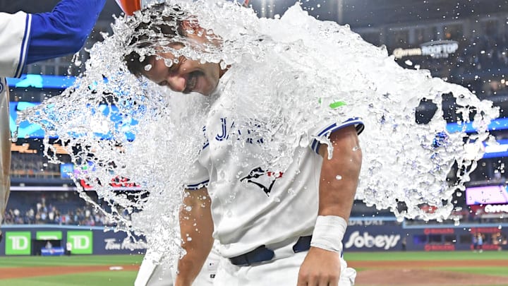Jul 6, 2025; Toronto, Ontario, CAN;  Toronto Blue Jays left fielder Davis Schneider (36) is doused with ice water as he celebrates a win over the Los Angeles Angels at Rogers Centre. 