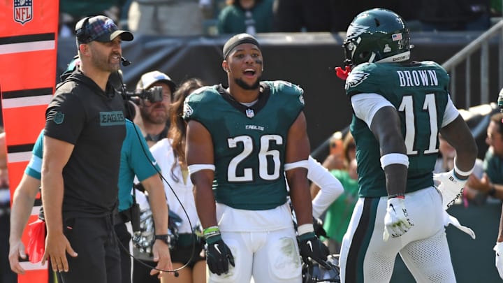 Philadelphia Eagles head coach Nick Sirianni and running back Saquon Barkley (26) celebrate touchdown catch by wide receiver A.J. Brown.