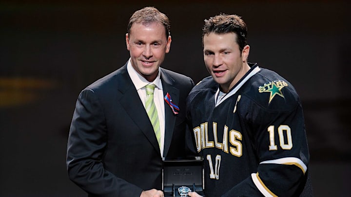 Oct 29, 2011; Dallas, TX, USA; Dallas Stars general manager Joe Nieuwendyk (left) and left wing Brenden Morrow (10) participate in pre-game ceremonies before the game against the New Jersey Devils at the American Airlines Center. The Stars defeated the Devils 3-1. Mandatory Credit: Jerome Miron-Imagn Images