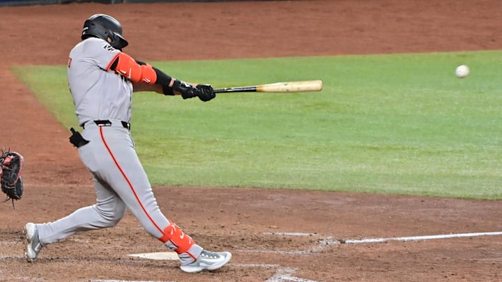 Sep 23, 2024; Phoenix, Arizona, USA;  San Francisco Giants outfielder Michael Conforto (8) doubles in the seventh inning against the Arizona Diamondbacks at Chase Field.