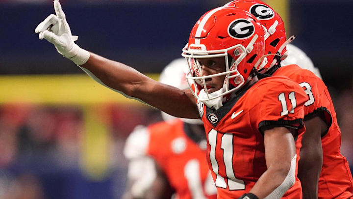 Georgia Bulldogs linebacker Jalon Walker (11) reacts against the Texas Longhorns during the first half in the 2024 SEC Championship game at Mercedes-Benz Stadium.