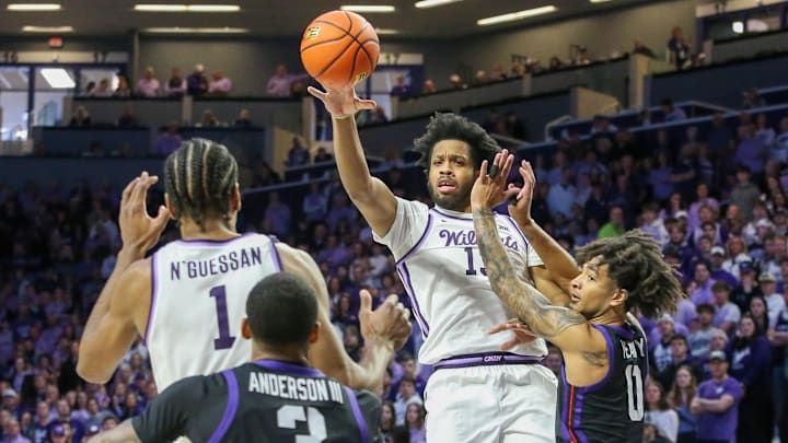 Feb 17, 2024; Manhattan, Kansas, USA; Kansas State Wildcats center Will McNair Jr. (13) passes the ball to teammate David N'Guessan (1).