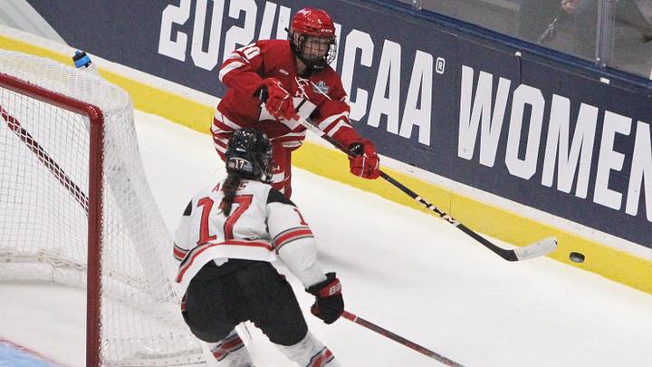 Wisconsin's Vivian Jungels controls the puck as Ohio State's Jocelyn Amos defends in the NCAA women's hockey national championship game at Whittemore Center Arena in Durham, New Hampshire, on Sunday March 24, 2024.