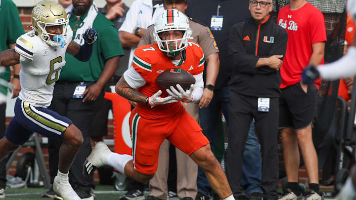 Nov 9, 2024; Atlanta, Georgia, USA; Miami Hurricanes wide receiver Xavier Restrepo (7) catches a pass for a touchdown against the Georgia Tech Yellow Jackets in the fourth quarter at Bobby Dodd Stadium at Hyundai Field.