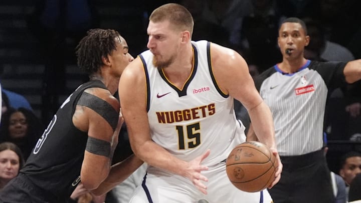 Nikola Jokic handles the basketball