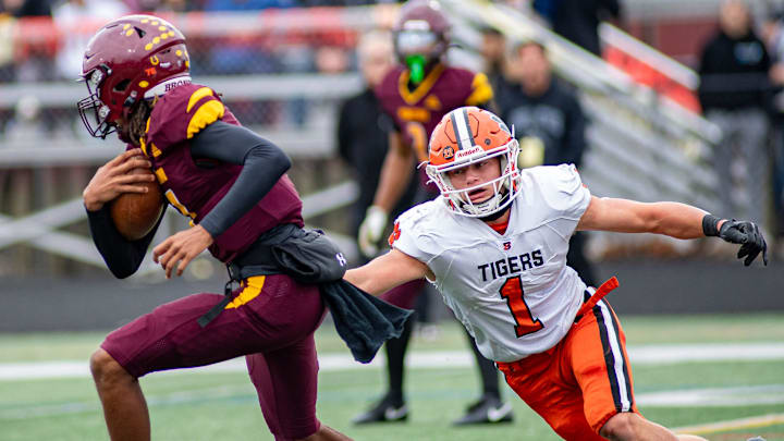 Byron tries to tackle Montini Catholic during the first quarter of the Round 2 playoff game in Lombard on Saturday, Nov. 9, 2024.