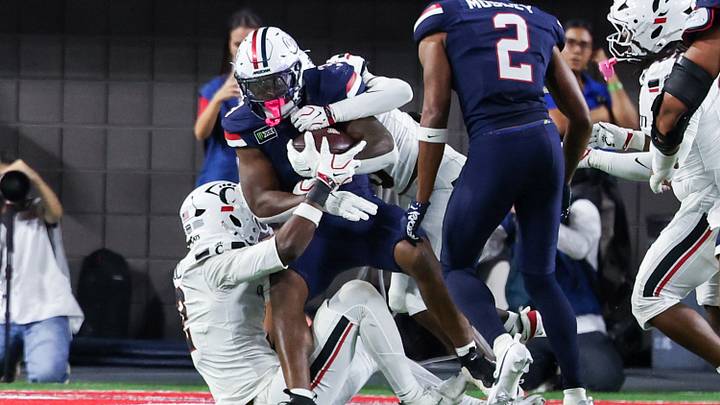 Oct 3, 2026; Tucson, Arizona, USA; Arizona Wildcats running back Kedrick Reescano (3) gets tackled during the third quarter of the game against the Cincinnati Bearcats at Casino Del Sol Stadium. Oct 3, 2026; Tucson, Arizona, USA; Arizona Wildcats running back Kedrick Reescano (3) gets tackled during the third quarter of the game against the Cincinnati Bearcats at Casino Del Sol Stadium.