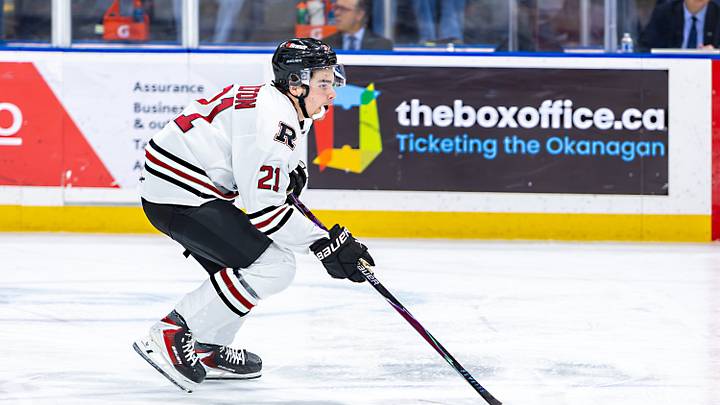 Beckett Hamilton #21 of the Red Deer Rebels carries the puck against the Kelowna Rockets
