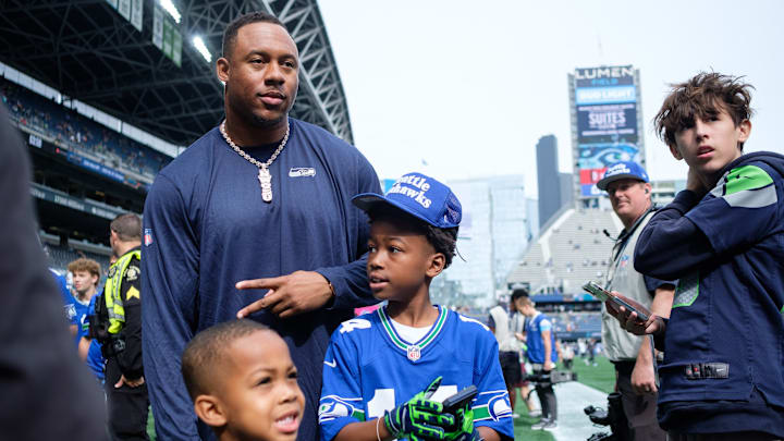 Sep 22, 2024; Seattle, Washington, USA; Seattle Seahawks linebacker Uchenna Nwosu (10) takes a photo with fans before the game against Miami Dolphins at Lumen Field. Sep 22, 2024; Seattle, Washington, USA; Seattle Seahawks linebacker Uchenna Nwosu (10) takes a photo with fans before the game against Miami Dolphins at Lumen Field.