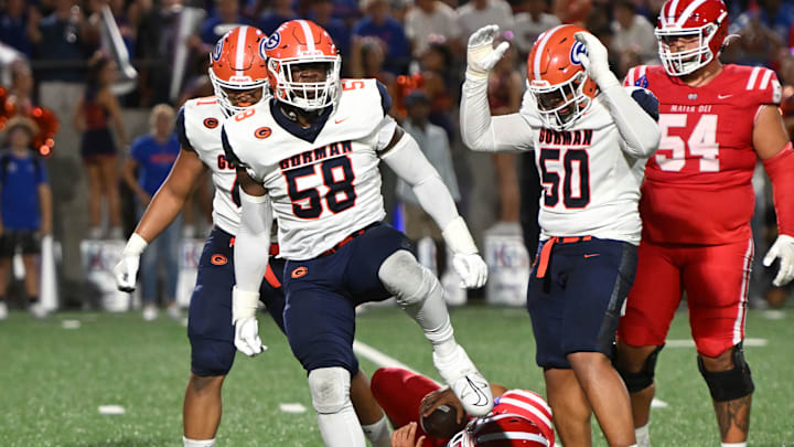 Bishop Gorman defensive tackle James Carrington celebrates after sacking Mater Dei quarterback Ashton Beierly.