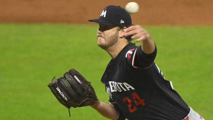Sep 17, 2024; Cleveland, Ohio, USA; Minnesota Twins starting pitcher Cole Irvin (24) delivers a pitch in the fifth inning against the Cleveland Guardians at Progressive Field.