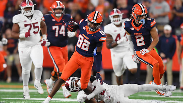 Sep 20, 2024; Syracuse, New York, USA; Syracuse Orange wide receiver Darrell Gill Jr. (82) runs as Stanford Cardinal cornerback Collin Wright (6) attempts to tackle during the second half at the JMA Wireless Dome. Mandatory Credit: Rich Barnes-Imagn Images Sep 20, 2024; Syracuse, New York, USA; Syracuse Orange wide receiver Darrell Gill Jr. (82) runs as Stanford Cardinal cornerback Collin Wright (6) attempts to tackle during the second half at the JMA Wireless Dome. Mandatory Credit: Rich Barnes-Imagn Images
