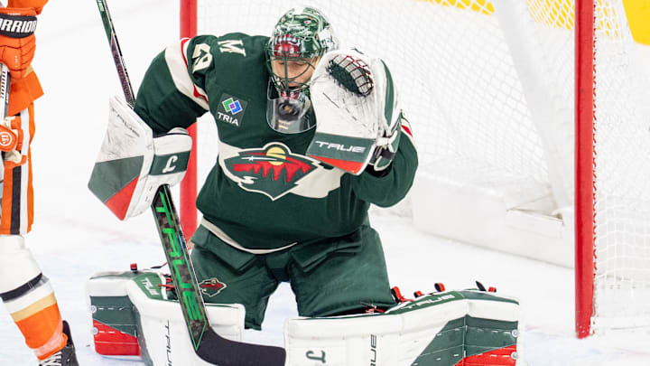 Apr 15, 2025; Saint Paul, Minnesota, USA; Minnesota Wild goaltender Marc-Andre Fleury (29) makes a save with Anaheim Ducks right wing Troy Terry (19) screening the shot in overtime at Xcel Energy Center. Mandatory Credit: Matt Blewett-Imagn Images