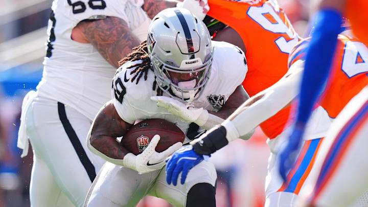 Oct 6, 2024; Denver, Colorado, USA; Las Vegas Raiders running back Sincere McCormick (28) during the second quarter against the Denver Broncos at Empower Field at Mile High. Mandatory Credit: Ron Chenoy-Imagn Images