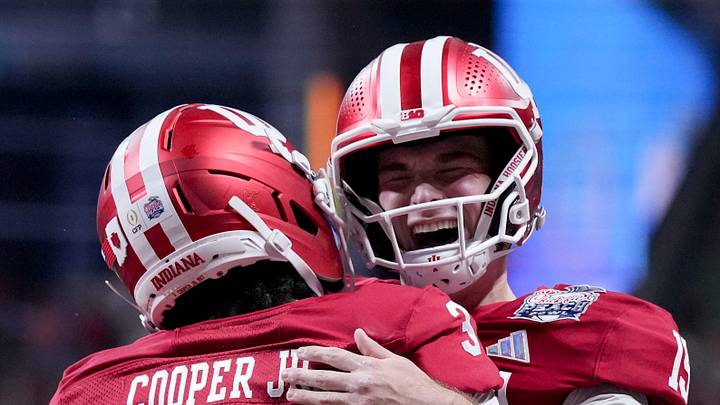 Indiana Hoosiers quarterback Fernando Mendoza (15) celebrates with Indiana Hoosiers wide receiver Omar Cooper Jr. (3) celebrate after connecting for a touchdown Friday, Jan. 9, 2026, during the Peach Bowl and semifinal game of the College Football Playoff against the Oregon Ducks at Mercedes-Benz Stadium in Atlanta. Indiana Hoosiers quarterback Fernando Mendoza (15) celebrates with Indiana Hoosiers wide receiver Omar Cooper Jr. (3) celebrate after connecting for a touchdown Friday, Jan. 9, 2026, during the Peach Bowl and semifinal game of the College Football Playoff against the Oregon Ducks at Mercedes-Benz Stadium in Atlanta.
