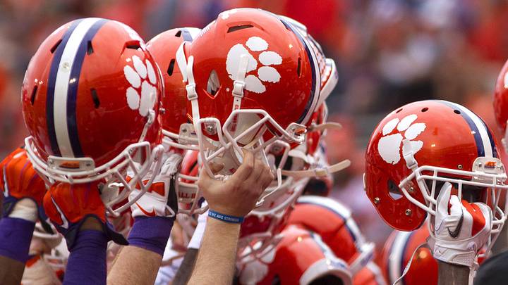 Nov 7, 2015; Clemson, SC, USA; Clemson Tigers players hold their helmets up prior to the game against the Florida State Seminoles at Clemson Memorial Stadium. Nov 7, 2015; Clemson, SC, USA; Clemson Tigers players hold their helmets up prior to the game against the Florida State Seminoles at Clemson Memorial Stadium.