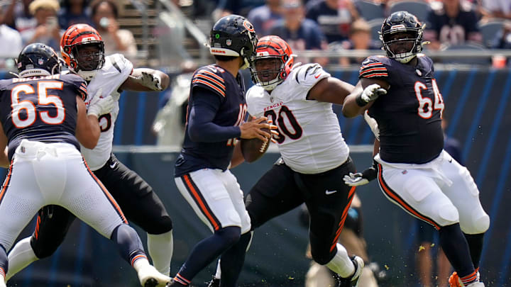 Cincinnati Bengals defensive tackle Kris Jenkins Jr. (90) breaks through a block from Chicago Bears guard Nate Davis (64) to sack quarterback Caleb Williams (18) in the second quarter of the NFL Preseason Week 2 game between the Chicago Bears and the Cincinnati Bengals at Soldier Field in downtown Chicago on Saturday, Aug. 17, 2024. The Bears led 10-3 at halftime. Cincinnati Bengals defensive tackle Kris Jenkins Jr. (90) breaks through a block from Chicago Bears guard Nate Davis (64) to sack quarterback Caleb Williams (18) in the second quarter of the NFL Preseason Week 2 game between the Chicago Bears and the Cincinnati Bengals at Soldier Field in downtown Chicago on Saturday, Aug. 17, 2024. The Bears led 10-3 at halftime.
