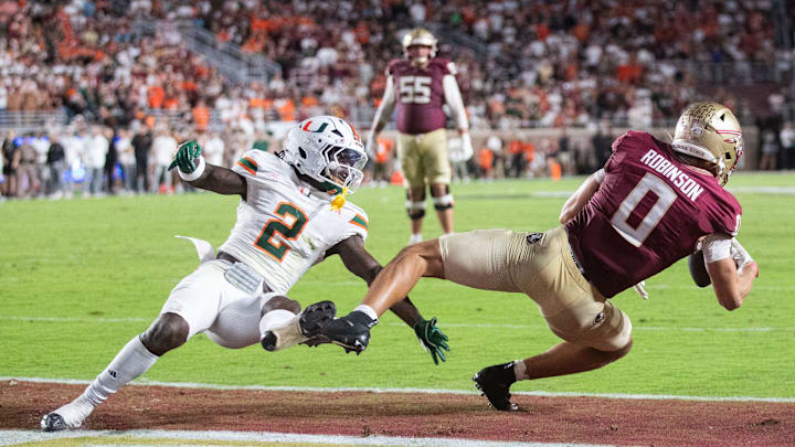 Florida State Seminoles wide receiver Duce Robinson (0) tries to catch the ball in the end zone. The Miami Hurricanes defeated the Florida State Seminoles 22-28 at Doak Campbell Stadium on Saturday, Oct. 4, 2025. Florida State Seminoles wide receiver Duce Robinson (0) tries to catch the ball in the end zone. The Miami Hurricanes defeated the Florida State Seminoles 22-28 at Doak Campbell Stadium on Saturday, Oct. 4, 2025.