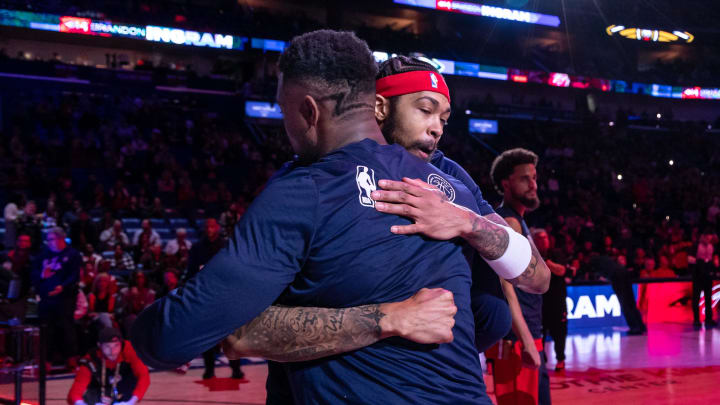 Feb 14, 2024; New Orleans, Louisiana, USA; New Orleans Pelicans forward Brandon Ingram (14) hugs forward Zion Williamson (1) as he is announced to the fans to start the game against the Washington Wizards during the first half at Smoothie King Center. Feb 14, 2024; New Orleans, Louisiana, USA; New Orleans Pelicans forward Brandon Ingram (14) hugs forward Zion Williamson (1) as he is announced to the fans to start the game against the Washington Wizards during the first half at Smoothie King Center.