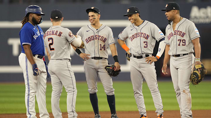Jun 5, 2023: Houston Astros third baseman Alex Bregman (2), second baseman Mauricio Dubon (14), shortstop Jeremy Pena (3) and first baseman Jose Abreu (79)  talk with Toronto Blue Jays first baseman Vladimir Guerrero Jr. (27) during a pitching change during the seventh inning at Rogers Centre.