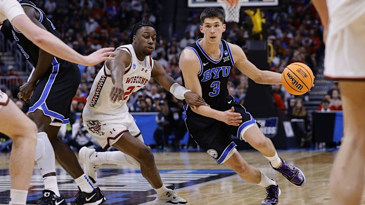 Mar 22, 2025; Denver, CO, USA; Brigham Young Cougars guard Egor Demin (3) dribbles the ball past Wisconsin Badgers guard John Blackwell (25) during the second half in the second round of the NCAA Tournament at Ball Arena. Mandatory Credit: Isaiah J. Downing-Imagn Images Mar 22, 2025; Denver, CO, USA; Brigham Young Cougars guard Egor Demin (3) dribbles the ball past Wisconsin Badgers guard John Blackwell (25) during the second half in the second round of the NCAA Tournament at Ball Arena. Mandatory Credit: Isaiah J. Downing-Imagn Images