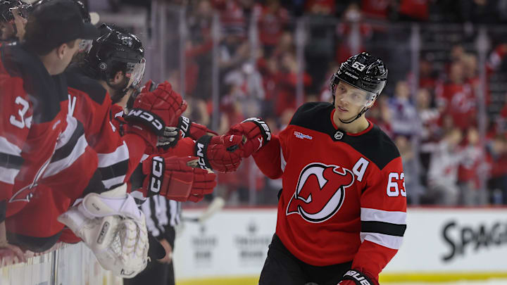 Mar 31, 2025; Newark, New Jersey, USA; New Jersey Devils left wing Jesper Bratt (63) celebrates his goal against the Minnesota Wild during the overtime shootout at Prudential Center. Mandatory Credit: Ed Mulholland-Imagn Images