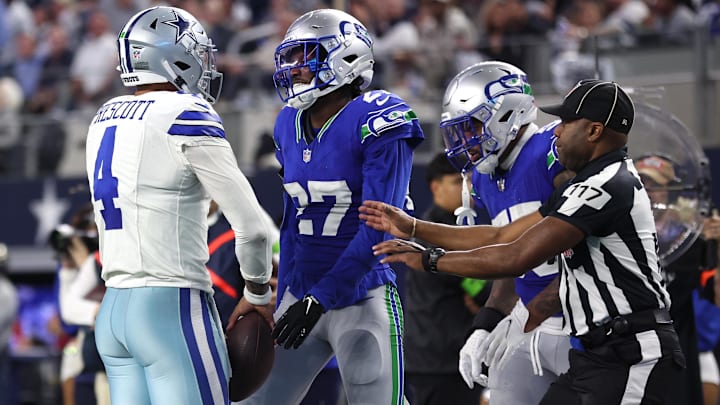 Nov 30, 2023; Arlington, Texas, USA; Dallas Cowboys quarterback Dak Prescott (4) and Seattle