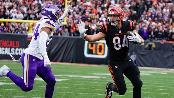 Cincinnati Bengals tight end Mitchell Wilcox (84) runs the ball as Minnesota Vikings safety Camryn