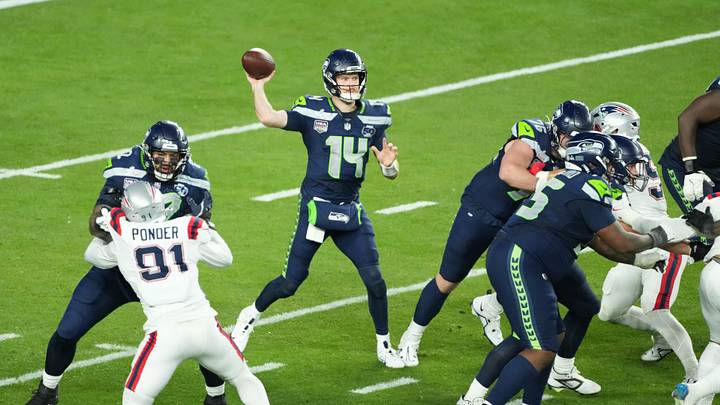 Seattle Seahawks quarterback Sam Darnold (14) throws a pass against the New England Patriots. Seattle Seahawks quarterback Sam Darnold (14) throws a pass against the New England Patriots.