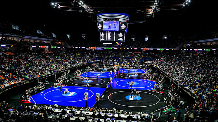 A general view as wrestlers compete on eight mats during the 2024 NCAA Wrestling Championships. 
