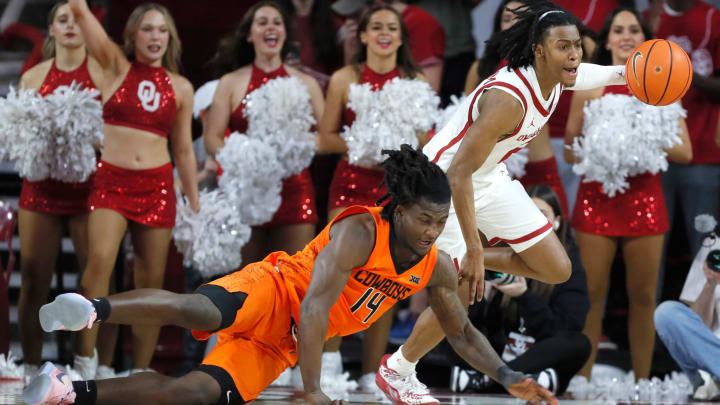 Oklahoma Sooners guard Javian McCollum (2) gathers the ball beside Oklahoma State Cowboys guard Jamyron Keller (14) during a Bedlam college basketball game between the University of Oklahoma Sooners (OU) and the Oklahoma State Cowboys (OSU) at Lloyd Noble Center in Norman, Okla., Saturday, Feb. 10, 2024. Oklahoma won 66-62. Oklahoma Sooners guard Javian McCollum (2) gathers the ball beside Oklahoma State Cowboys guard Jamyron Keller (14) during a Bedlam college basketball game between the University of Oklahoma Sooners (OU) and the Oklahoma State Cowboys (OSU) at Lloyd Noble Center in Norman, Okla., Saturday, Feb. 10, 2024. Oklahoma won 66-62.
