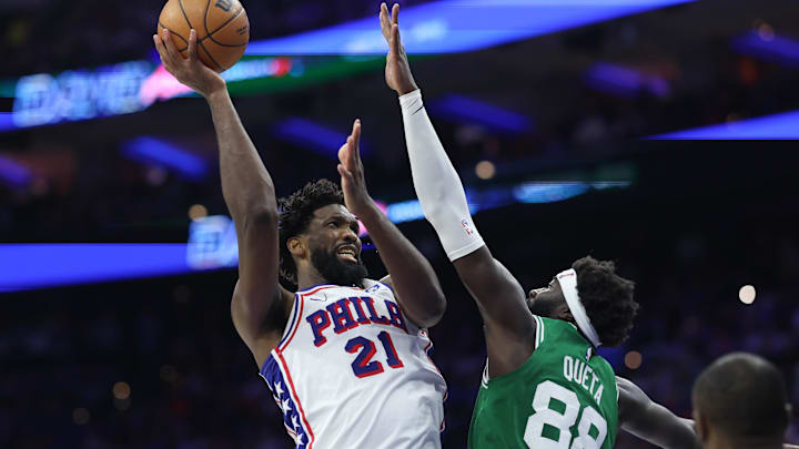 Apr 30, 2026; Philadelphia, Pennsylvania, USA; Philadelphia 76ers center Joel Embiid (21) drives for a shot against Boston Celtics center Neemias Queta (88) during the third quarter at Xfinity Mobile Arena. Mandatory Credit: Bill Streicher-Imagn Images