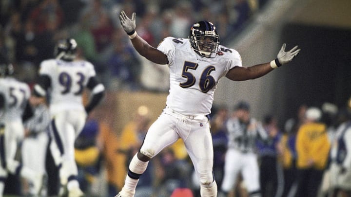 Jan 28, 2001; Tampa, FL, USA; FILE PHOTO; Baltimore Ravens linebacker Anthony Davis (56) celebrates after a touchdown against the New York Giants during Super Bowl XXXV. The Ravens defeated the Giants 34-7 at Raymond James Stadium. Mandatory Credit: Imagn Images