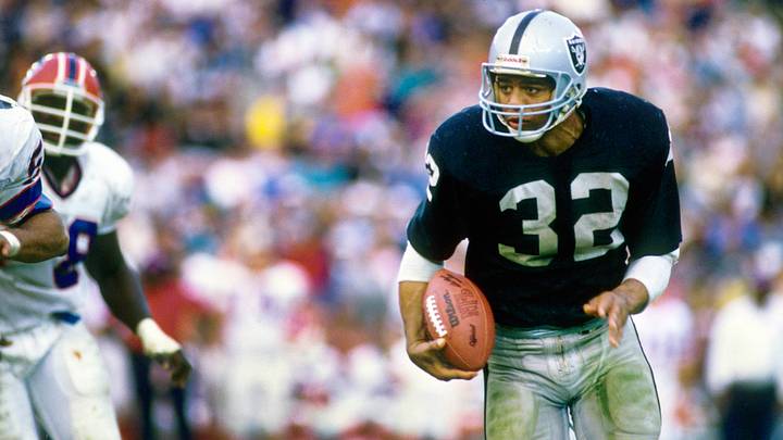 Dec 6, 1987; Los Angeles, CA, USA; FILE PHOTO; Los Angeles Raiders running back Marcus Allen (32) carries the ball against the Buffalo Bills at the Coliseum. Mandatory Credit: MPS-USA TODAY Sports