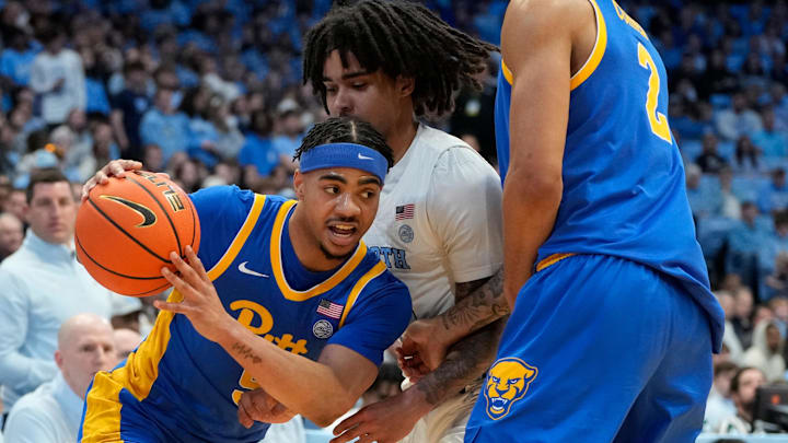 Feb 8, 2025; Chapel Hill, North Carolina, USA; Pittsburgh Panthers guard Ishmael Leggett (5) with the ball as North Carolina Tar Heels guard Elliot Cadeau (3) defends in the first half at Dean E. Smith Center. Mandatory Credit: Bob Donnan-Imagn Images Feb 8, 2025; Chapel Hill, North Carolina, USA; Pittsburgh Panthers guard Ishmael Leggett (5) with the ball as North Carolina Tar Heels guard Elliot Cadeau (3) defends in the first half at Dean E. Smith Center. Mandatory Credit: Bob Donnan-Imagn Images