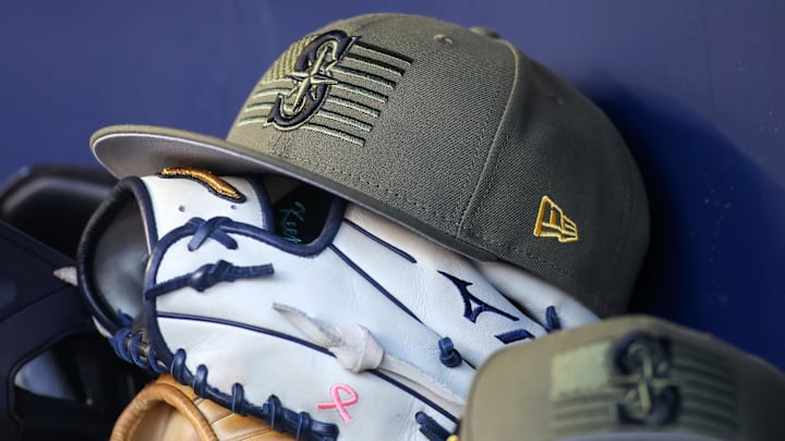 The Seattle Mariners Armed Forces Day hat is pictured in the dugout before a game against the Atlanta Braves on May 20, 2023, at Truist Park.