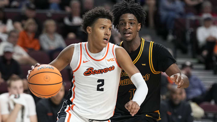 March 8, 2026; Las Vegas, NV, USA; Oregon State Beavers guard Josiah Lake II (2) dribbles the basketball against San Francisco Dons center Saba Gigiberia (10) during the second half at Orleans Arena. Mandatory Credit: Kyle Terada-Imagn Images