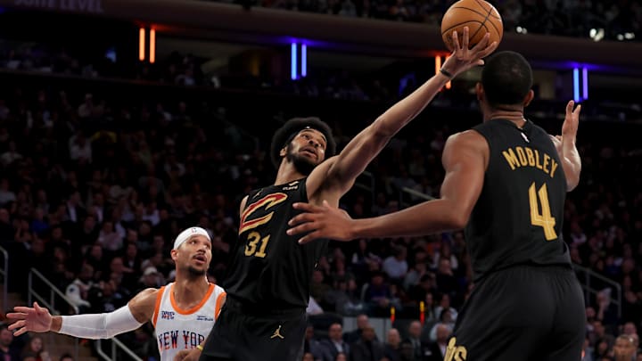 Apr 11, 2025; New York, New York, USA; Cleveland Cavaliers center Jarrett Allen (31) grabs a rebound against New York Knicks guard Josh Hart (3) in front of Cavaliers forward Evan Mobley (4) during the second quarter at Madison Square Garden. Mandatory Credit: Brad Penner-Imagn Images