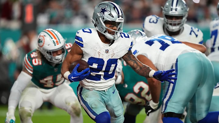 Dec 24, 2023; Miami Gardens, Florida, USA; Dallas Cowboys running back Tony Pollard (20) runs the