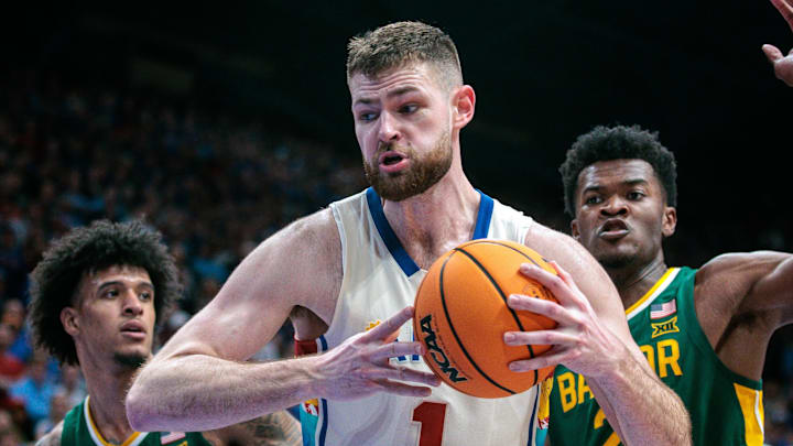 Feb 10, 2024; Lawrence, Kansas, USA; Kansas Jayhawks center Hunter Dickinson (1) protects the ball