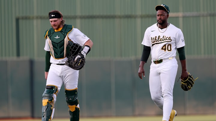 Jun 7, 2025; West Sacramento, California, USA; Athletics catcher Willie Maclver (65) and starting pitcher Luis Severino (40) walk towards the dugout before the start of the game against the Baltimore Orioles at Sutter Health Park. Mandatory Credit: Dennis Lee-Imagn Images