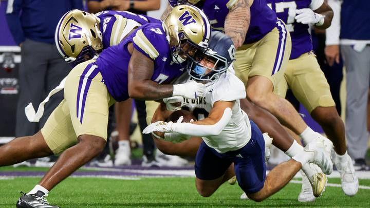 Huskies linebacker Taariq Al-Uqdah (3) tackles UC Davis Aggies running back Jordan Fisher (20). Huskies linebacker Taariq Al-Uqdah (3) tackles UC Davis Aggies running back Jordan Fisher (20).