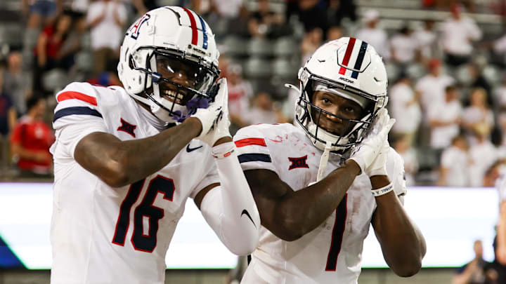 Aug 31, 2024; Tucson, Arizona, USA; Arizona Wildcats running back Jacory Croskey-Merritt (1) celebrates touchdown with Arizona Wildcats wide receiver Chris Hunter (16) during fourth quarter at Arizona Stadium Aug 31, 2024; Tucson, Arizona, USA; Arizona Wildcats running back Jacory Croskey-Merritt (1) celebrates touchdown with Arizona Wildcats wide receiver Chris Hunter (16) during fourth quarter at Arizona Stadium